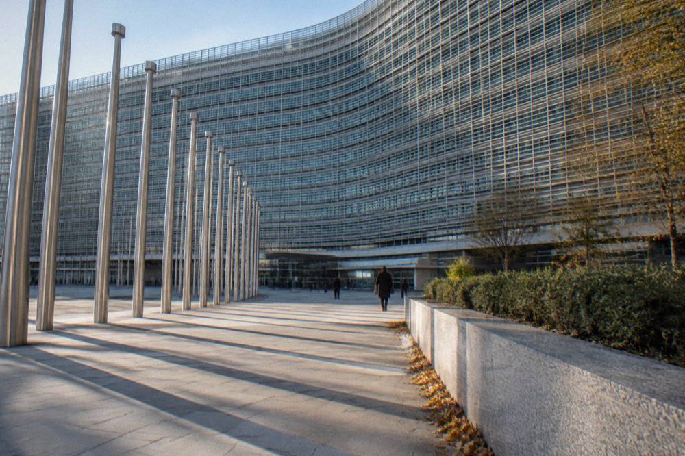 Wide plaza between European institution buildings in Brussels on a clear day