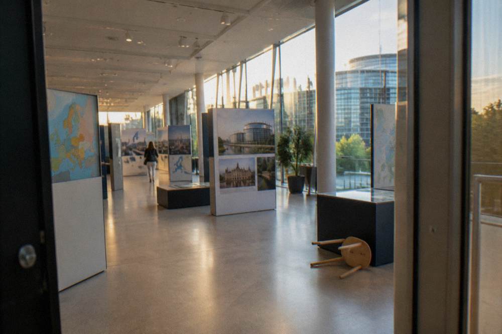 Exhibition hall interior with display panels and high ceilings