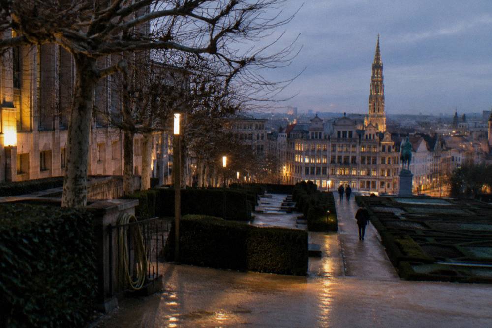 Lit pathways and terraced gardens of Mont des Arts in Brussels in the early evening