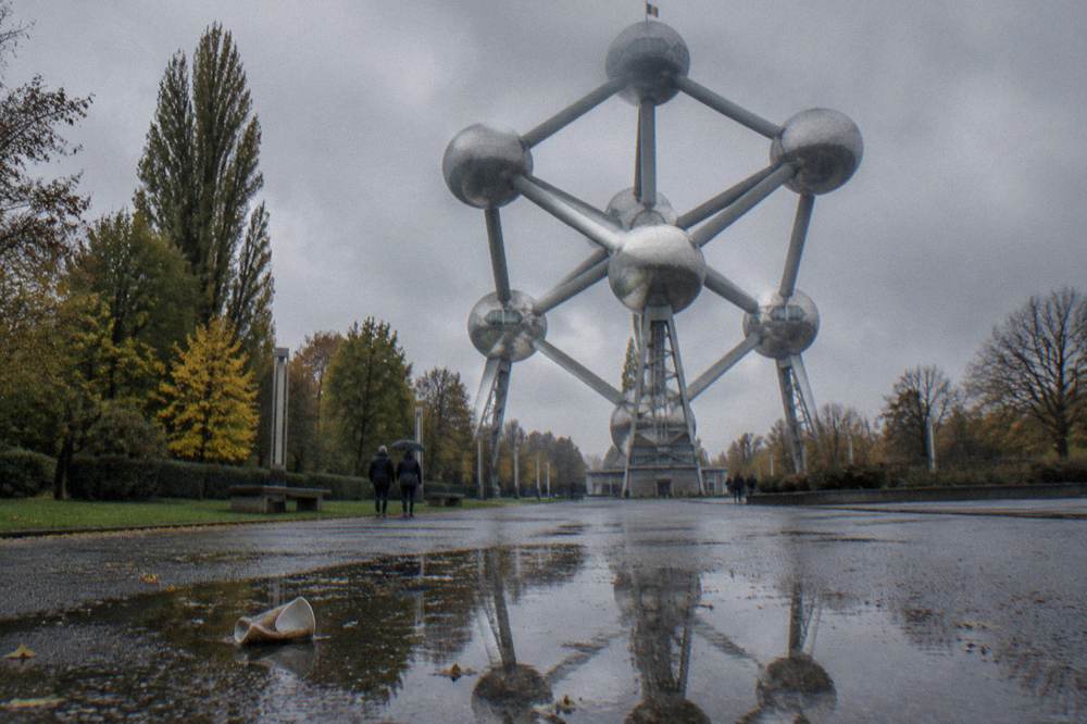 Open plaza ground in front of the Atomium with the sphere structure filling the sky
