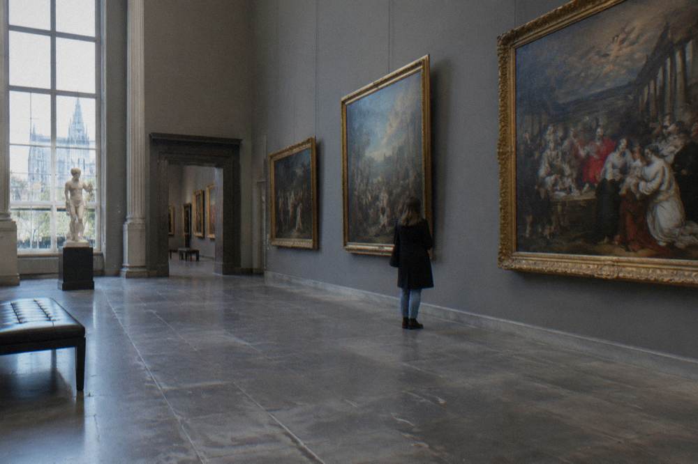 The Old Masters Museum gallery space in Brussels with framed paintings along the wall