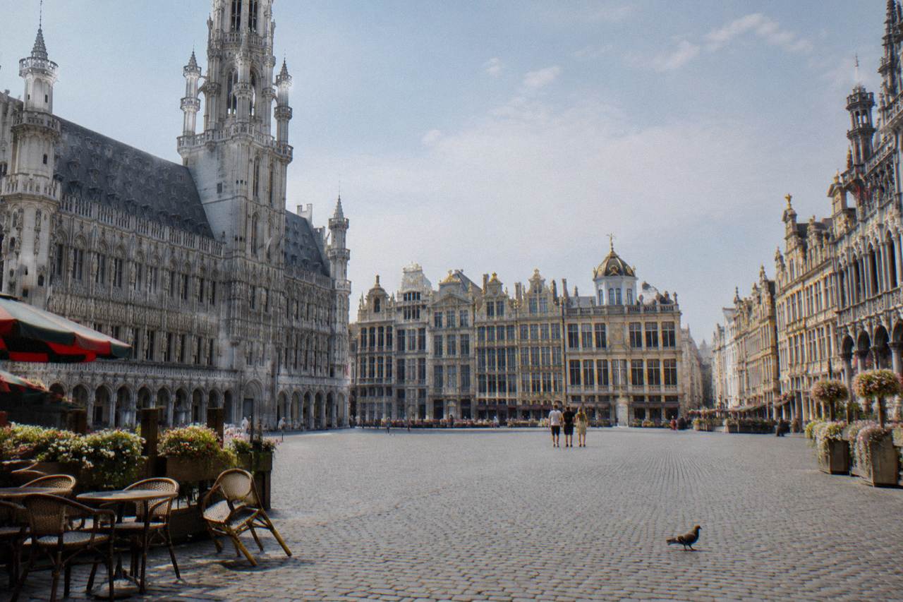 Grand-Place in Brussels with guild houses and the Town Hall tower under a daytime sky
