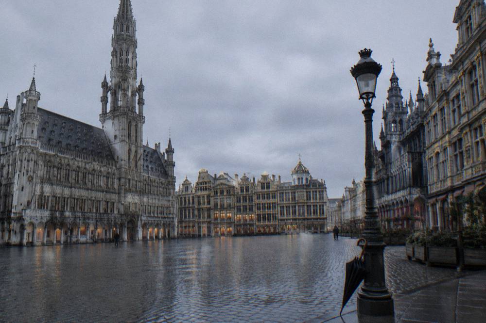 The Grand-Place square in Brussels seen at ground level with guild house facades and no crowds