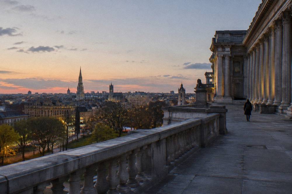 The terrace viewpoint at Place Poelaert overlooking the city at dusk