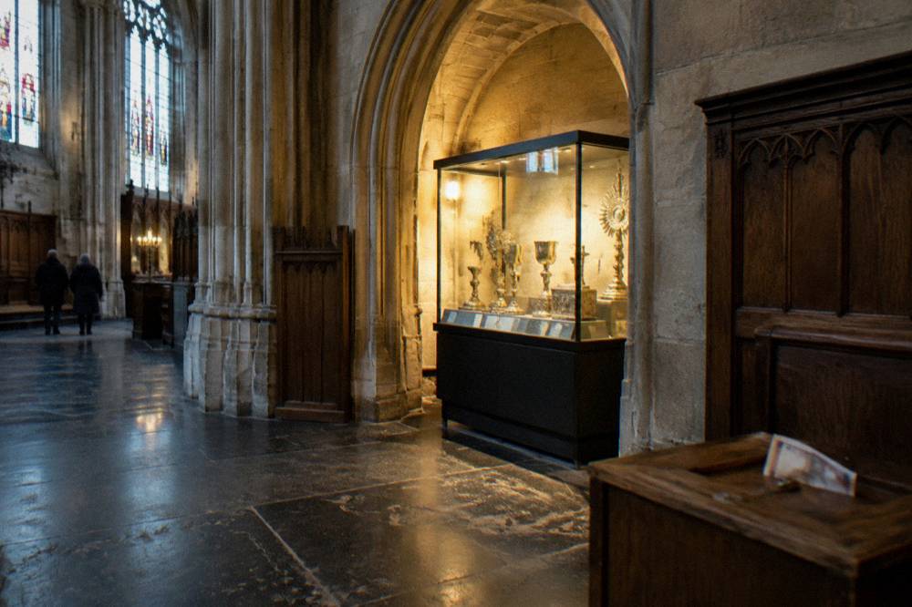 Stone archway and display case inside a cathedral treasury room