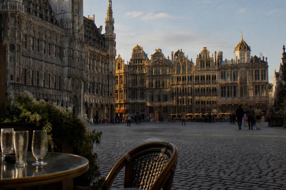 Wide ornate guild-house facades around a large cobblestone square in Brussels
