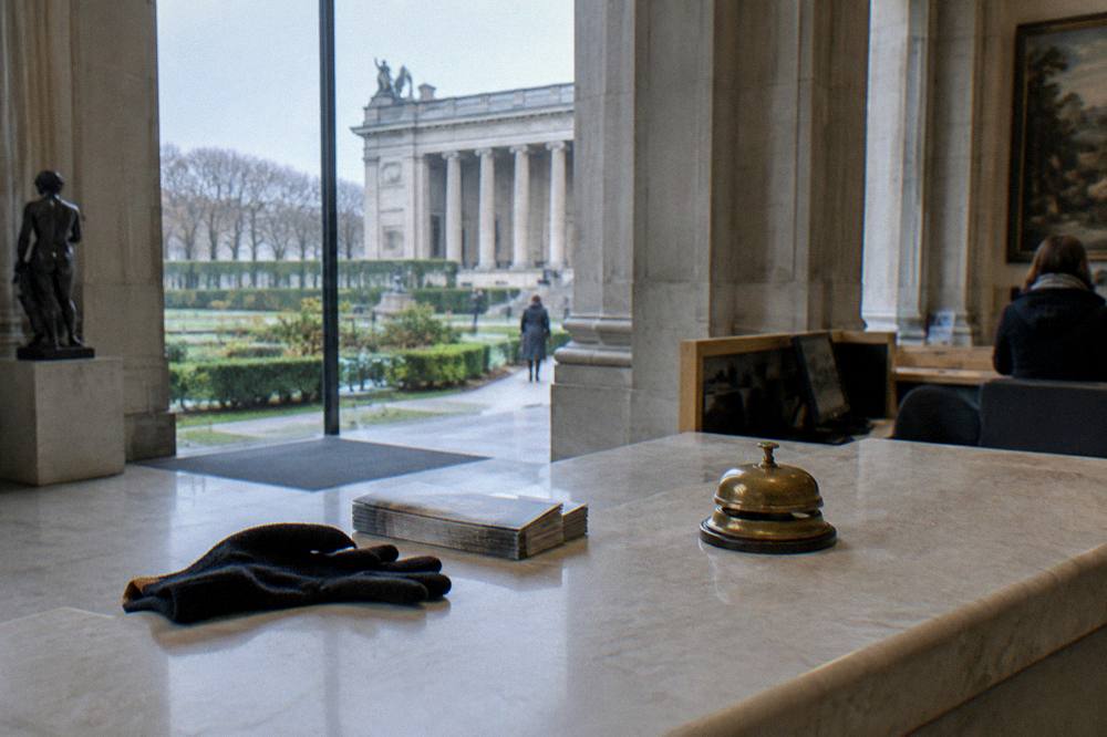 Museum ticket desk with counter and information signage