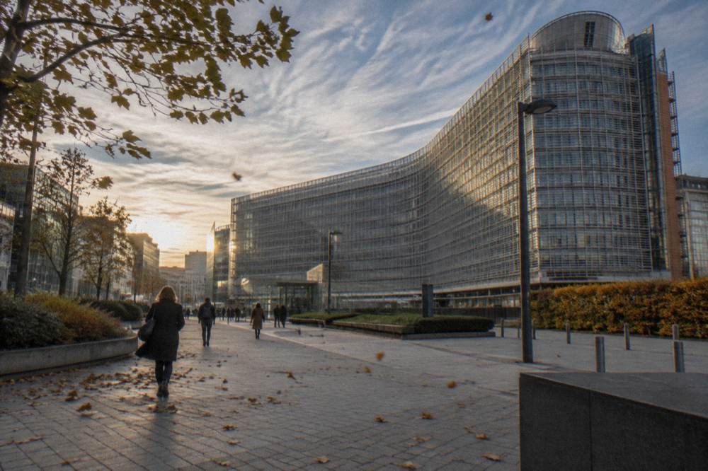Modern glass buildings of the European Quarter in Brussels under a wide sky