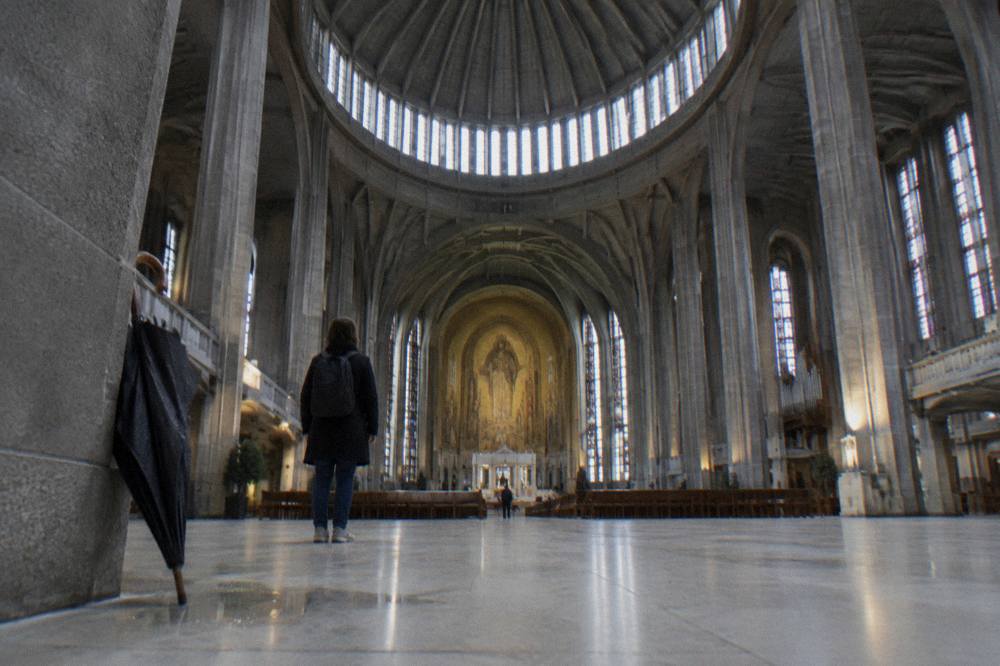 The interior of the Koekelberg Basilica church with its high domed ceiling and wide stone floor