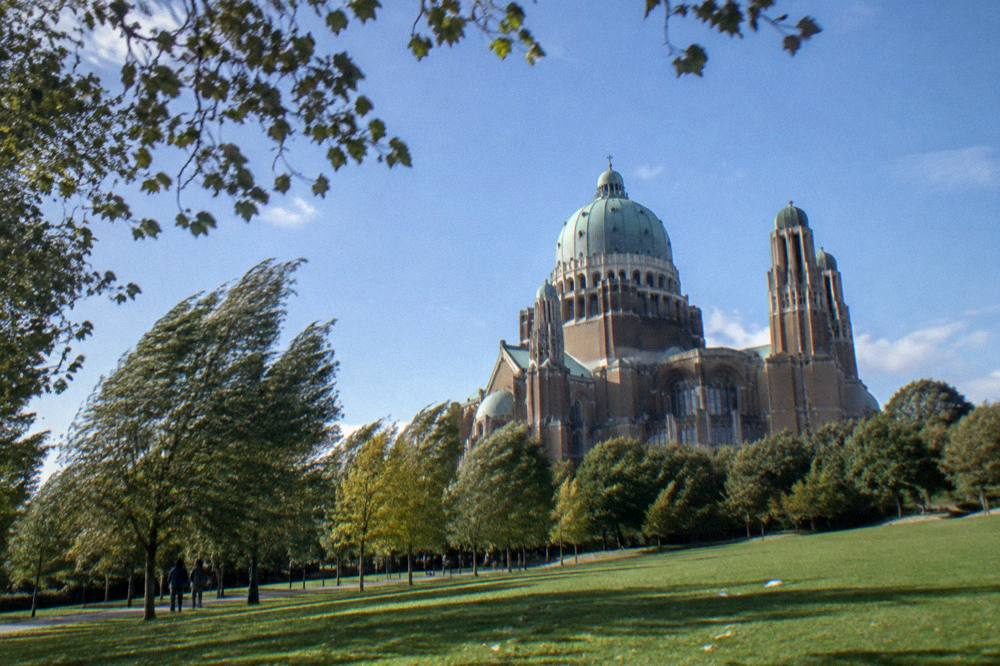 The Koekelberg Basilica dome and tower against an open sky from the park