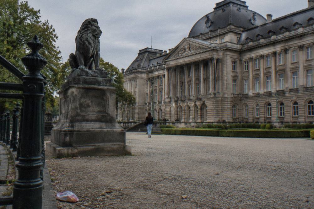 The front facade of the Royal Palace of Brussels on a clear day with the square in front